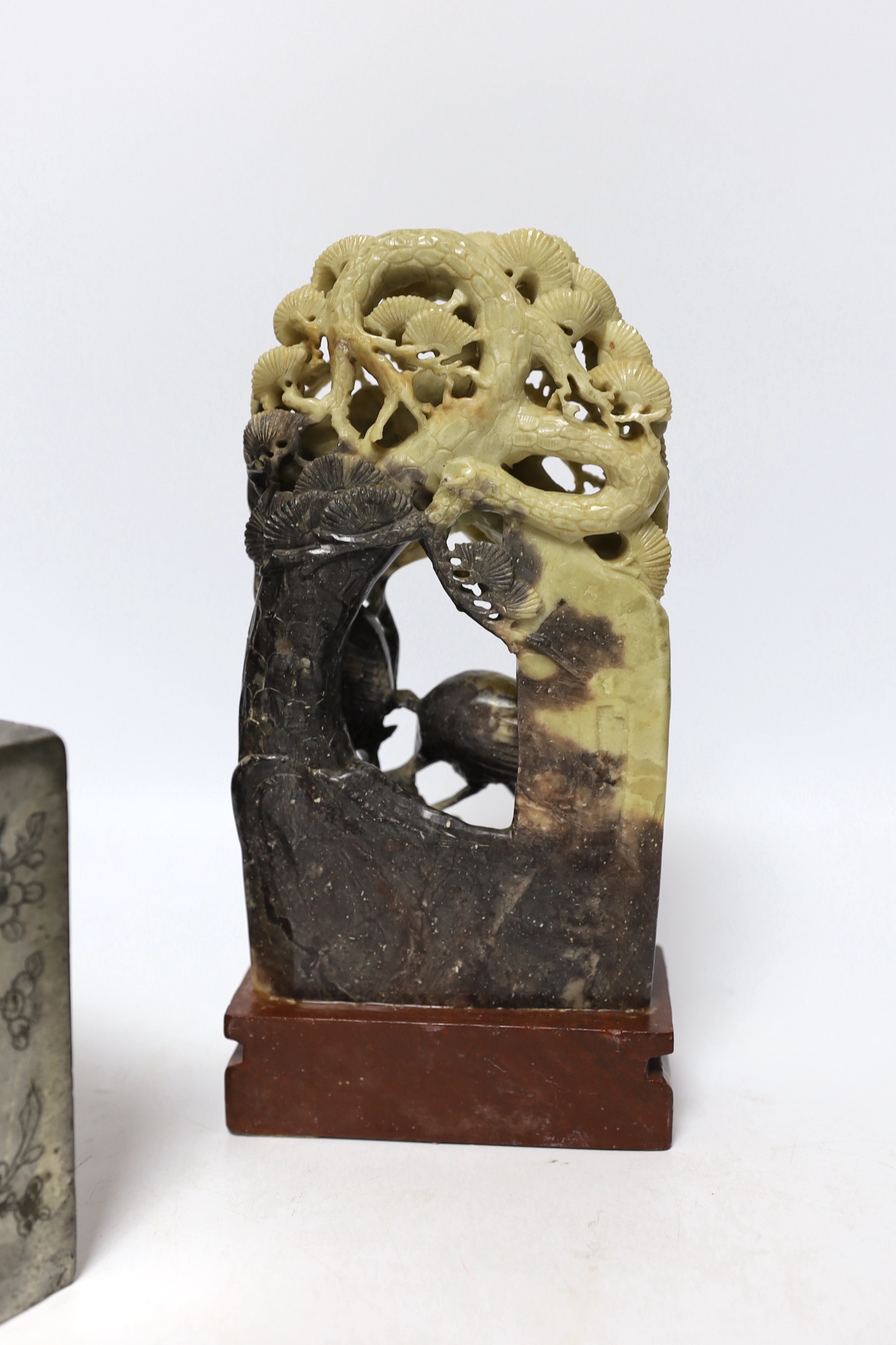 Two Chinese soapstone carvings and a pewter tea canister decorated with birds, largest 24cm high
